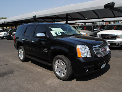 gmc yukon 2011 black suv slt flex fuel 8 cylinders 2 wheel drive automatic 76087