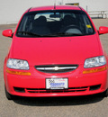 chevrolet aveo 2004 red hatchback 1 6 gasoline 4 cylinders front wheel drive 5 speed manual 56001