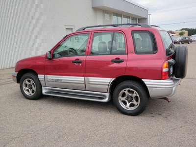 chevrolet tracker 2001 red suv lt 4wd gasoline 6 cylinders 4 wheel drive automatic with overdrive 56001