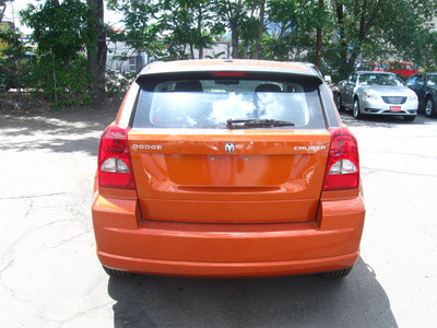 dodge caliber 2011 orange hatchback mainstreet gasoline 4 cylinders front wheel drive automatic 80301