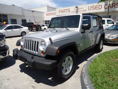 jeep wrangler unlimited 2010 silver suv sport gasoline 6 cylinders 2 wheel drive automatic 33157