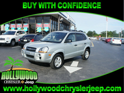 hyundai tucson 2009 silver suv gls gasoline 4 cylinders front wheel drive automatic 33021