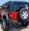 jeep wrangler unlimited 2011 red suv sport gasoline 6 cylinders 4 wheel drive automatic 34731