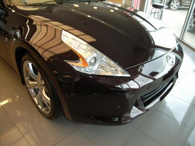 nissan 370z 2011 dk  red coupe gasoline 6 cylinders rear wheel drive not specified 46219