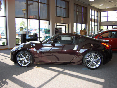 nissan 370z 2010 dk  red coupe touring gasoline 6 cylinders rear wheel drive automatic 47130