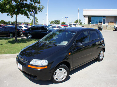 chevrolet aveo 2004 black hatchback gasoline 4 cylinders front wheel drive 5 speed manual 76205