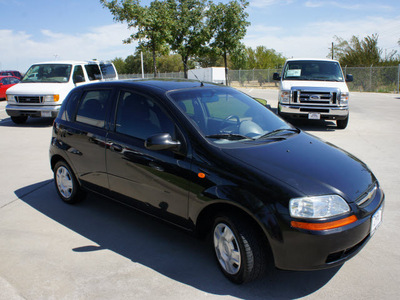 chevrolet aveo 2004 black hatchback gasoline 4 cylinders front wheel drive 5 speed manual 76205