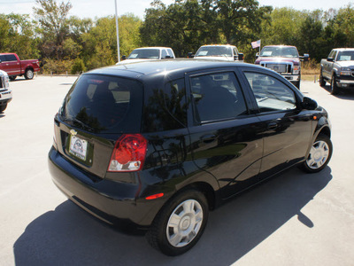 chevrolet aveo 2004 black hatchback gasoline 4 cylinders front wheel drive 5 speed manual 76205