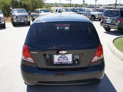 chevrolet aveo 2004 black hatchback gasoline 4 cylinders front wheel drive 5 speed manual 76205