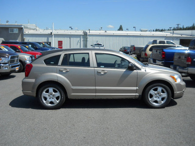 dodge caliber 2009 gold wagon sxt gasoline 4 cylinders front wheel drive cont  variable trans  99212