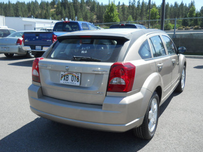 dodge caliber 2009 gold wagon sxt gasoline 4 cylinders front wheel drive cont  variable trans  99212