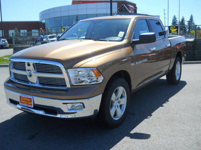 ram ram pickup 1500 2011 saddle brown pearl big horn gasoline 8 cylinders 4 wheel drive 5 speed automatic 99212