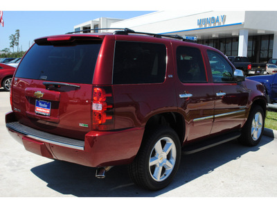 chevrolet tahoe 2011 red suv ltz flex fuel 8 cylinders 2 wheel drive automatic with overdrive 77090