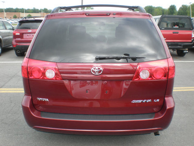 toyota sienna 2009 red van gasoline 6 cylinders front wheel drive automatic 13502