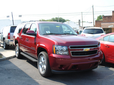chevrolet suburban 2011 red suv ls 1500 flex fuel 8 cylinders 4 wheel drive automatic 27591