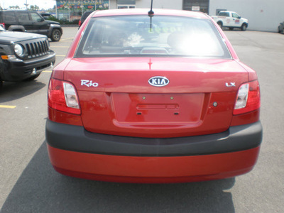 kia rio 2009 red sedan gasoline 4 cylinders front wheel drive automatic with overdrive 13502