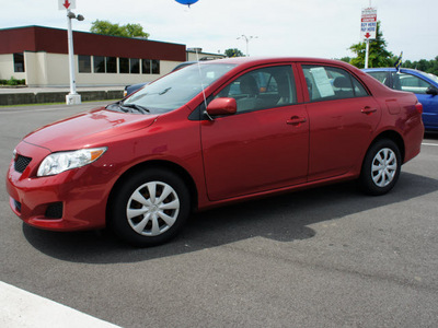 toyota corolla 2009 red sedan le gasoline 4 cylinders front wheel drive automatic 47129