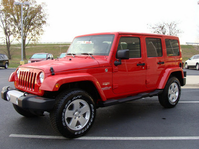 jeep wrangler unlimited 2011 red suv sahara gasoline 6 cylinders 4 wheel drive automatic 60915