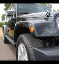 jeep wrangler unlimited 2010 black suv sahara gasoline 6 cylinders 4 wheel drive 75570