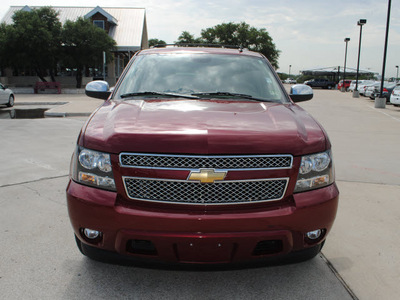 chevrolet tahoe 2009 red suv ltz gasoline 8 cylinders 2 wheel drive automatic 76087