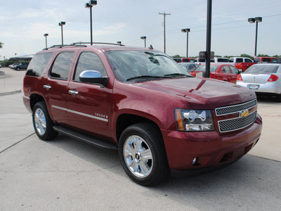 chevrolet tahoe 2009 red suv ltz gasoline 8 cylinders 2 wheel drive automatic 76087