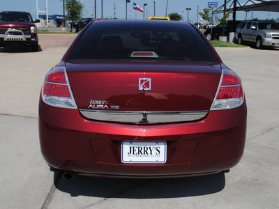 saturn aura 2009 maroon sedan xe gasoline 4 cylinders front wheel drive automatic 76087