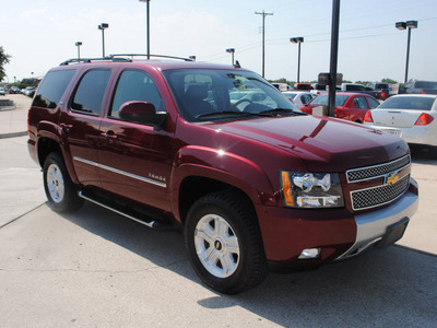 chevrolet tahoe 2010 red suv z71 flex fuel 8 cylinders 4 wheel drive automatic 76087