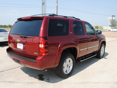 chevrolet tahoe 2010 red suv z71 flex fuel 8 cylinders 4 wheel drive automatic 76087