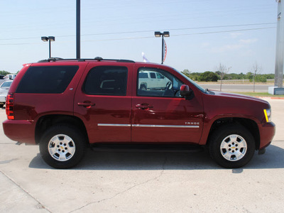 chevrolet tahoe 2010 red suv lt flex fuel 8 cylinders 4 wheel drive automatic 76087