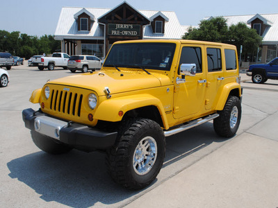 jeep wrangler unlimited 2011 yellow suv sahara gasoline 6 cylinders 4 wheel drive automatic with overdrive 76087