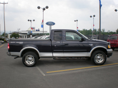 ford f 150 2001 blue gasoline 8 cylinders 4 wheel drive automatic with overdrive 13502