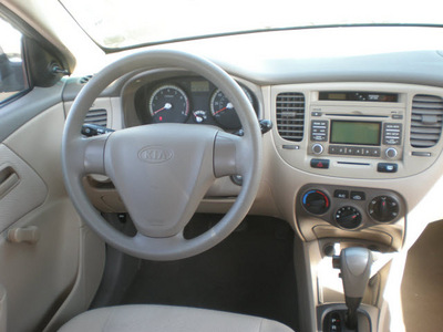 kia rio 2009 tan sedan gasoline 4 cylinders front wheel drive automatic 13502