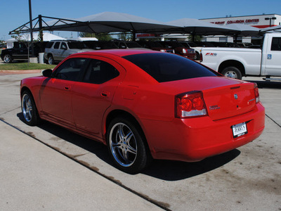 dodge charger 2009 red sedan gasoline 6 cylinders rear wheel drive automatic 76087