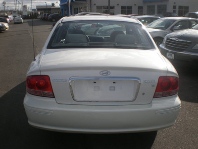 ford taurus 2005 gold sedan se flex fuel 6 cylinders front wheel drive automatic with overdrive 13502