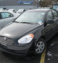 hyundai accent 2009 black sedan gls gasoline 4 cylinders front wheel drive 5 speed with overdrive 13502