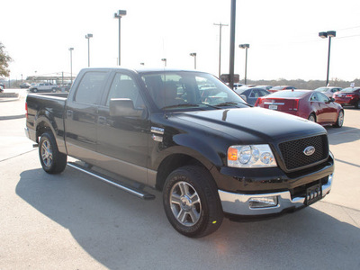 ford f 150 2005 black xlt gasoline 8 cylinders rear wheel drive automatic with overdrive 76087