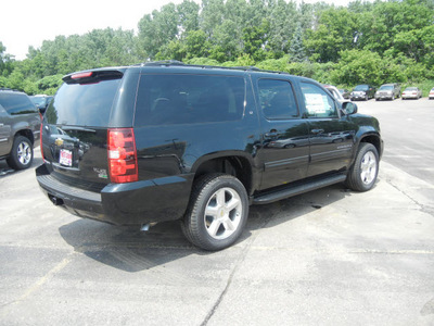 chevrolet suburban 2011 black suv lt 1500 dvd flex fuel 8 cylinders 4 wheel drive automatic with overdrive 55391