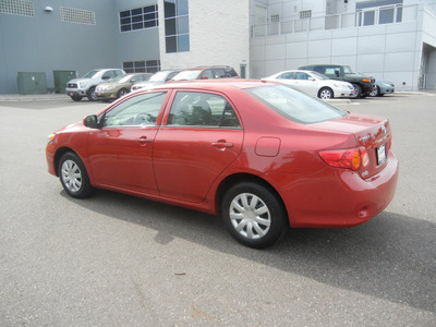 toyota corolla 2010 red sedan le gasoline 4 cylinders front wheel drive automatic 55448
