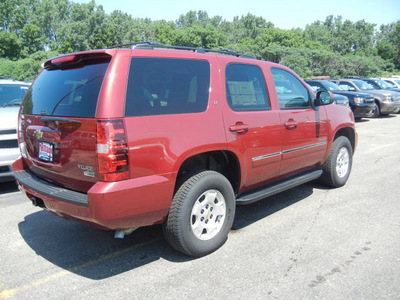 chevrolet tahoe 2011 red suv lt 4x4 dvd flex fuel 8 cylinders 4 wheel drive automatic with overdrive 55391