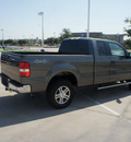 ford f 150 2006 dk  gray xlt flex fuel 8 cylinders 4 wheel drive automatic with overdrive 76108