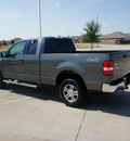 ford f 150 2006 dk  gray xlt flex fuel 8 cylinders 4 wheel drive automatic with overdrive 76108