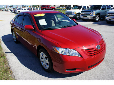 toyota camry 2009 red sedan le gasoline 4 cylinders front wheel drive automatic 33870