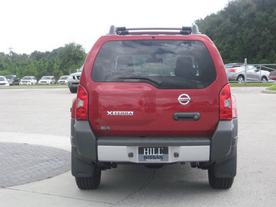 nissan xterra 2010 red suv gasoline 6 cylinders 2 wheel drive automatic 33884
