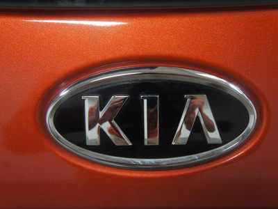 kia rio 2007 orange hatchback rio5 sx gasoline 4 cylinders front wheel drive 5 speed manual 76108