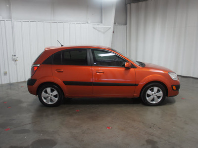 kia rio 2007 orange hatchback rio5 sx gasoline 4 cylinders front wheel drive 5 speed manual 76108