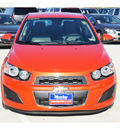 chevrolet sonic 2012 orange sedan 2 ls gasoline 4 cylinders front wheel drive 6 spd auto 77090