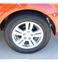 chevrolet sonic 2012 orange sedan 2 ls gasoline 4 cylinders front wheel drive 6 spd auto 77090
