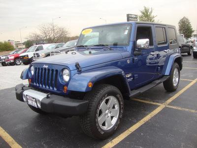 jeep wrangler unlimited 2010 blue suv sahara gasoline 6 cylinders 4 wheel drive automatic 60443