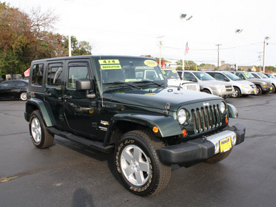 jeep wrangler unlimited 2010 green suv sahara gasoline 6 cylinders 4 wheel drive automatic with overdrive 07730