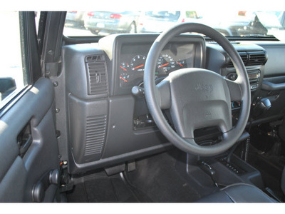jeep wrangler 2004 black suv rubicon gasoline 6 cylinders 4 wheel drive automatic 98632